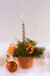 Photo: Christmas silver candles and red spheres on white skin Christmas silver candles and red spheres on white skin