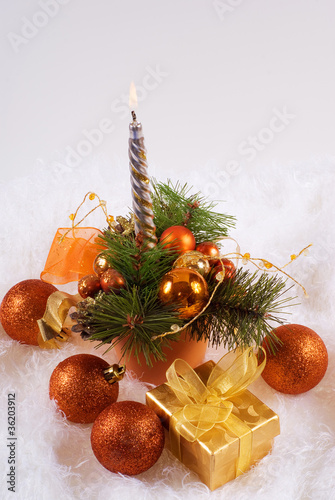 Photo: Christmas orange spheres and silver candles Christmas orange spheres and silver candles