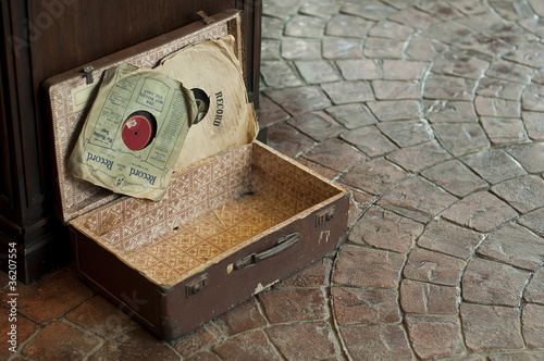 Photo: Old Antique suitcase with gramophone discs Old Antique suitcase with gramophone discs