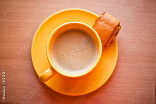 Photo: Coffee in an yellow cup Coffee in an yellow cup