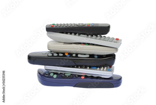 Photo: pile of six remote control, isolated on white background pile of six remote control, isolated on white background