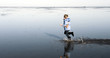 boy is running in the water