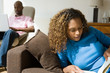 couple reading and using laptop couple reading and using laptop
