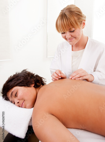 Photo: Acupuncturist with Young Male Patient Acupuncturist with Young Male Patient