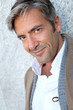 Portrait of handsome mature man in town