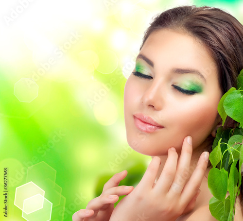 Photo: Beautiful Woman with green leaves Beautiful Woman with green leaves