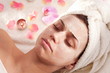 Young woman with cosmetic mask on her face.