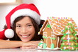 Christmas santa woman and gingerbread house