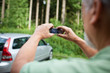 Insurance company guy taking pics of a newly insured vehicle.