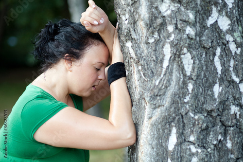 Photo: Sweaty overweight woman catching her breath Sweaty overweight woman catching her breath