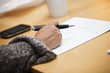 Hand with a pen