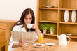Breakfast at home happy woman read newspapers Breakfast at home happy woman read newspapers