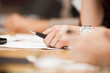 Hand with a pen