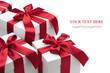 Gift boxes with red ribbons and bows.