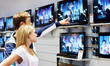 Young couple in consumer electronics megastore