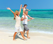 Happy family having fun on the beach