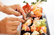 Chef in action preparing a sushi dish Chef in action preparing a sushi dish