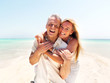 Cheerful mature having fun on the beach