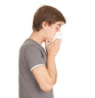 Photo: sick young man with flu blowing her nose sick young man with flu blowing her nose