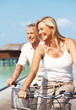 Happy mature on bikes outdoor smiling - Enjoying holidays