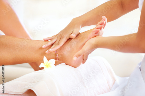 Photo: Salon worker giving a foot massage Salon worker giving a foot massage