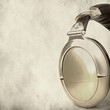 Photo: Professional stereo headphones over grunge background Professional stereo headphones over grunge background