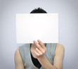 Young man with blank card