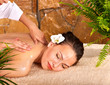 Young woman getting massage in spa. Young woman getting massage in spa.