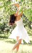Portrait of beautiful cute young girl yearning in leafage outdoo