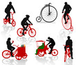 Silhouettes of people on bicycles.