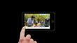 Smartphone showing families relaxing outside