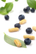 Photo: Bilberry pills and berries Bilberry pills and berries