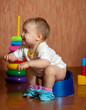 Toddler sitting on potty