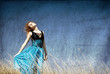 Redhead girl at windy field.