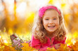 Happy Girl In Autumn Park