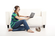 Foto: Listen music and using a laptop Listen music and using a laptop