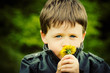 Photo: Child Smelling Flower Child Smelling Flower