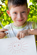 Foto: Cute little boy painted the sun Cute little boy painted the sun