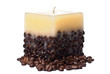 Candle with coffee beans isolated on white