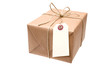brown paper parcel with a blank luggage tag