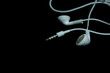 Photo: Earphones on a black background Earphones on a black background