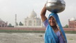 Indian Woman wearing Sari in front of Taj Mahal Indian Woman wearing Sari in front of Taj Mahal