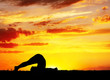 Yoga silhouette Halasana plough pose