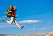 Hiker jumps on the rock Hiker jumps on the rock