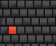 Black computer keyboard with a red button