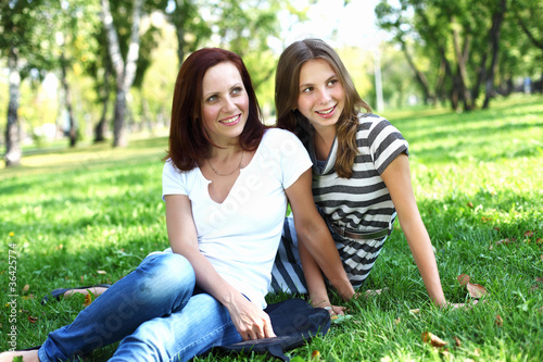 Photo: Mother with her daughter in summer park Mother with her daughter in summer park