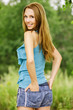 Foto: young charming woman standing back turned young charming woman standing back turned