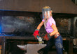 Attractive girl in workshop with instrument in hand Attractive girl in workshop with instrument in hand