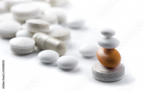 Photo: pills on white background metaphor pills on white background metaphor