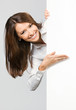 Businesswoman showing signboard, over grey